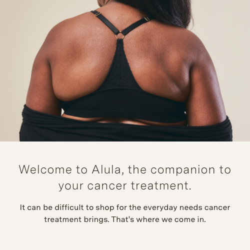 A woman wearing a bra, back to the camera. The text beneath reads: 'Welcome to Alula, the companion to your cancer treatment.'